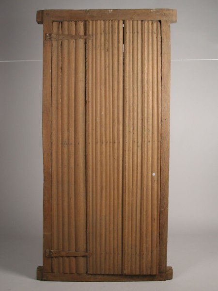 Room door in frame, door frame building part wood oak iron in frame, sawn planed nailed Room door curved up
