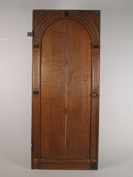 Room door with carving, door building part oak wood iron, hinges and locks) sawn planed cut laid out Panel door with four cleats