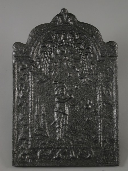 Fireback with bagpipe player, flower garlands, fish and shell, fire place cast iron, cast Rectangular fireplace plate with arch