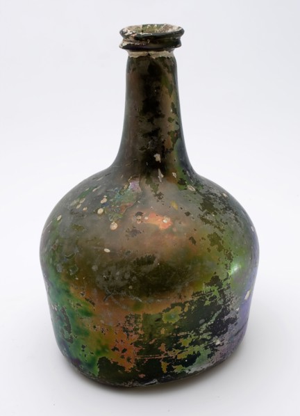 Bulbous bottle, 'hammer', bottle holder bottomfound glass, free blown and shaped glass application Bulky bottle in clear green