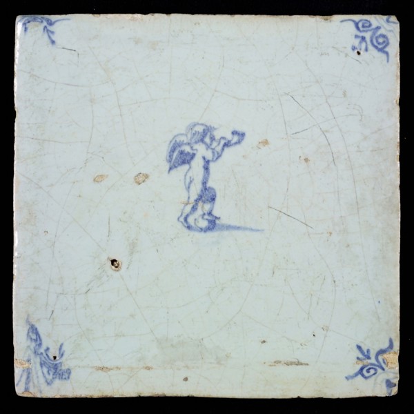 White tile with blue putto with wind instrument; corner pattern ox head, wall tile tile sculpture ceramic earthenware glaze