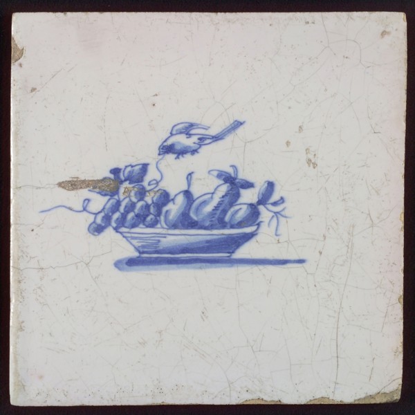 White tile with blue fruit basket with grapes and bird, wall tile tile sculpture ceramics pottery glaze, baked 2x glazed painted