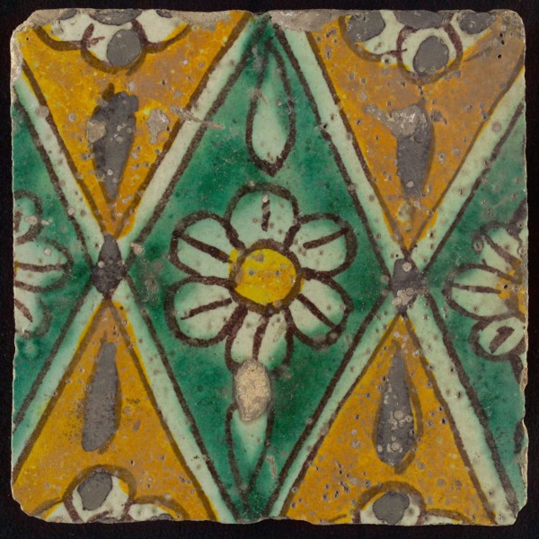 Floor tile, brown draft, green and yellow on white ground, central green oblique glass in which white flower with yellow heart