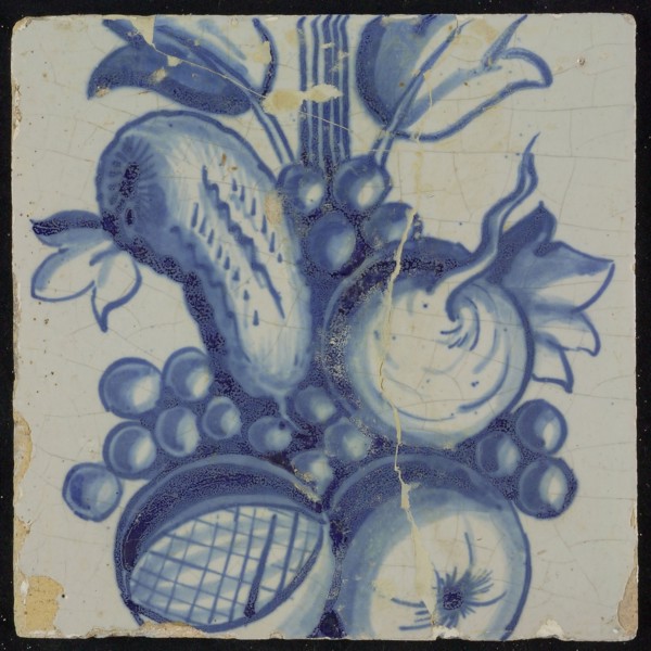 Tile of chimney pilaster, blue on white, part of up and down continuous representation with fruits, including pomegranate