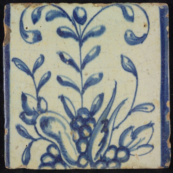 Tile of chimney pilaster, blue on white, part of up and down continuous representation with fruits and branches, chimney