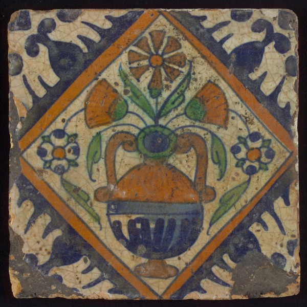 Tile, orange, brown, green, and blue on white, flowerpot in square, corner pattern palmet, wall tile tile sculpture ceramic