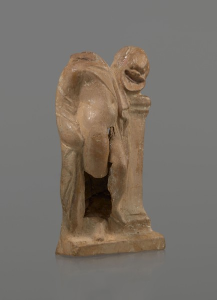 Terracotta figurine of a youth with a terracotta mask; maker, Hellenistic period 4th–1st century