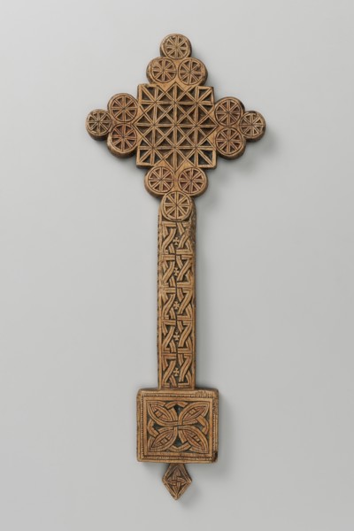 Hand cross, Ethiopian workshop. The arms of the cross are each formed by three stacked discs