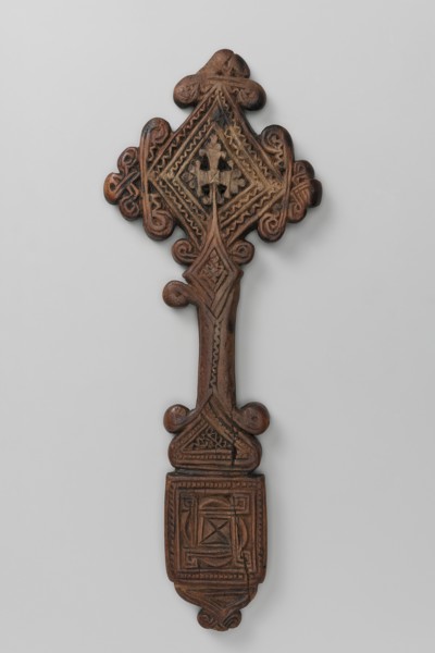 Hand cross, Ethiopian workshop. The arms of the cross are rhombus-shaped, the tops decorated with