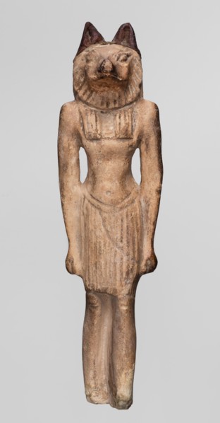 Amulet — Anubis. Anubis is depicted as a striding man with the head of a dog Canidae. Arms hang at