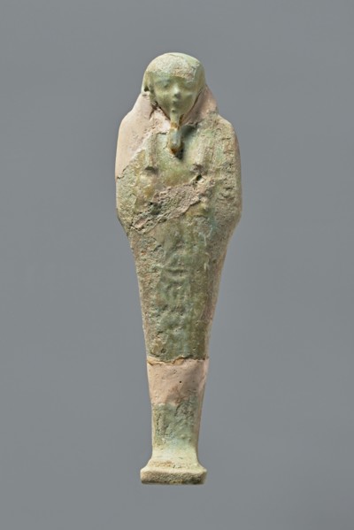 Ushabti, Mummy-shaped figurine, standing on a base with the back resting on a pillar. Arms crossed