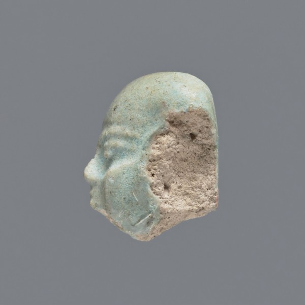 Fragment of a shabti;, Head of a shabti figurine with carefully rendered facial features. Celadon