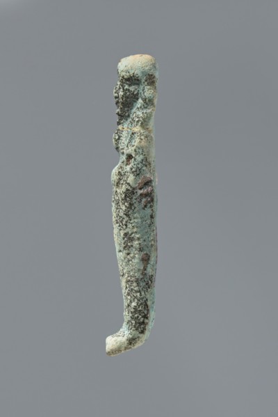 Ushabti, mummy-shaped figurine. Flat back. Arms crossed on the chest, only the hands protruding