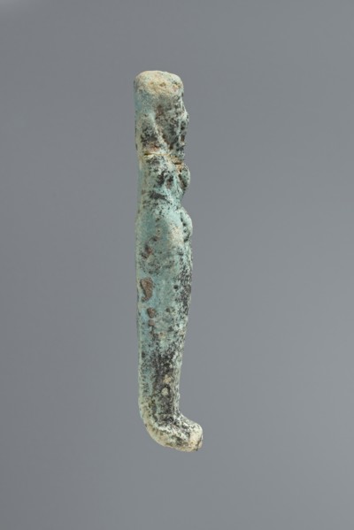Ushabti, mummy-shaped figurine. Flat back. Arms crossed on the chest, only the hands protruding