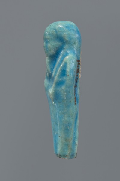 Shabti, mummy-shaped figurine, funerary gift; back supported by a pillar/pilaster. Legs missing up