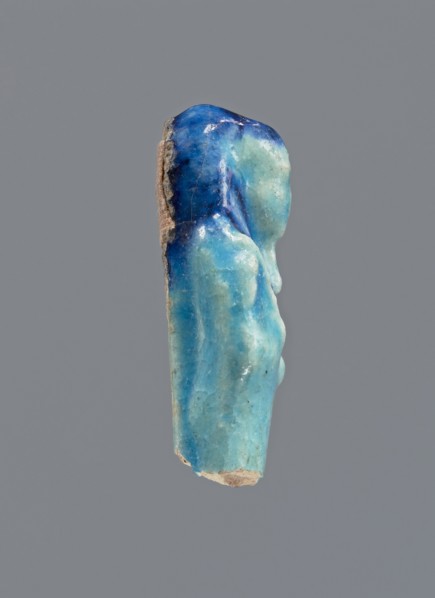 Shabti, Mummy-shaped figurine, funerary gift; back supported by a pillar/pilaster. Legs missing.