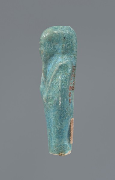 Shabti, mummy-shaped figurine supported at the back on a pillar. Legs missing from the knees down.