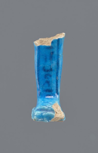 Shabti legs, Mummy-shaped figurine fragment preserved from the knees down. Feet rest on a base;