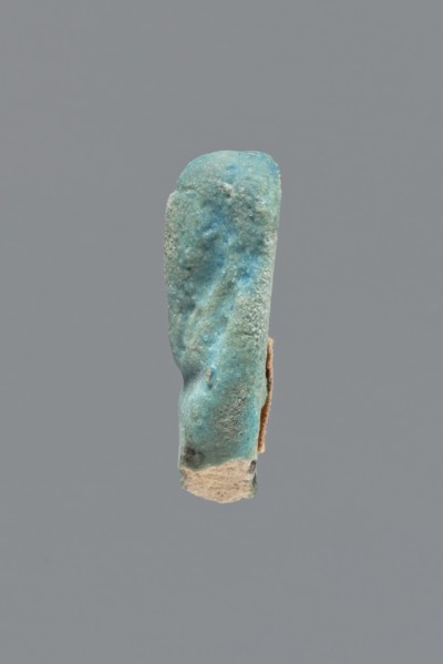Shabti, Mummy-shaped figurine, funerary gift. Legs missing. Arms crossed on the chest, hands