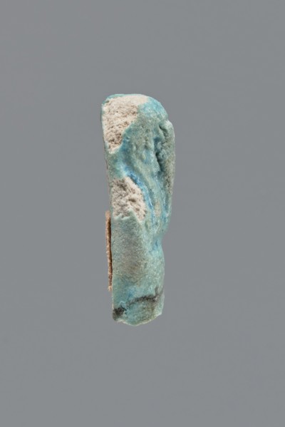 Shabti, Mummy-shaped funerary figurine, legs missing. Arms crossed on the chest, hands invisible