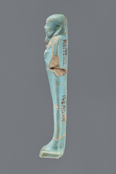 Ushabti, Mummy-shaped figurine, standing on a base with a narrow, slightly convex pillar at the