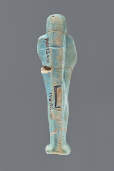 Ushabti, Mummy-shaped figurine, standing on a base with a narrow, slightly convex pillar at the