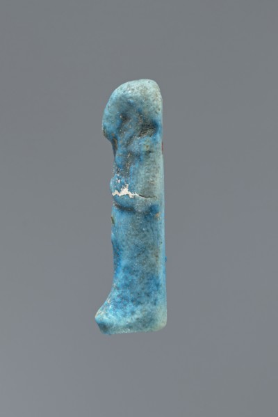 Ushabti, mummy-shaped figurine impressed in a mold, carelessly made of faience. The back is flat