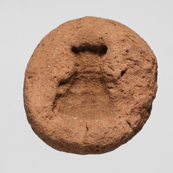 A mold for making an amulet — Bes mask, Bes myth.; mask amulet casting; mold; height 0.4 cm;