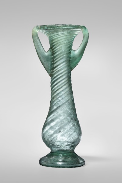 Unguentarium, unknown Eastern workshop. Glass vessel, transparent light green, Barag type VII: 1, 3