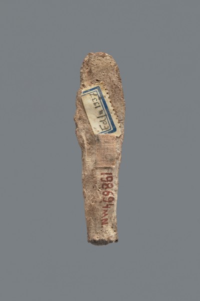 Shabti, Mummy-shaped figurine, funerary gift, made carelessly, impressed in a mold. Hands folded on