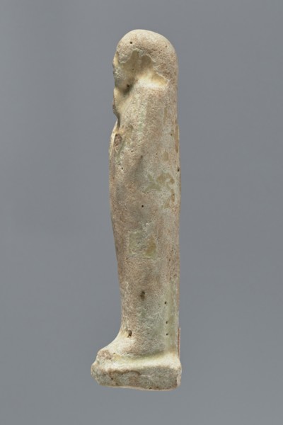 Ushabti, mummy-shaped figurine, funerary gift; standing on a base, back supported by a narrow flat