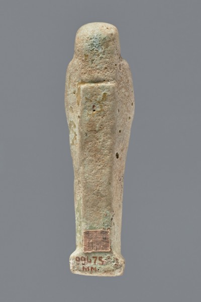 Ushabti, mummy-shaped figurine, funerary gift, hoes. Mummy-shaped figurine standing on a base, the