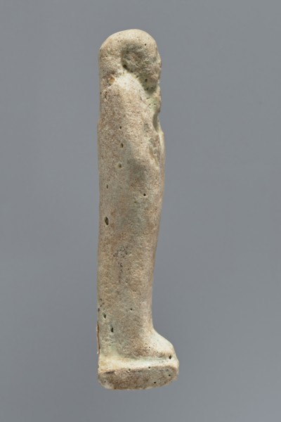 Ushabti, mummy-shaped figurine, funerary gift; standing on a base with the back supported by a