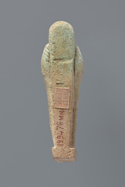 Ushabti, Mummy-shaped figurine, standing on a base, the back supported by a flat pillar. The arms