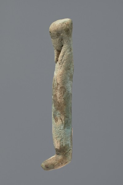 Ushabti, Mummy-shaped figurine, very schematically shaped. Hands crossed on the chest. On the head