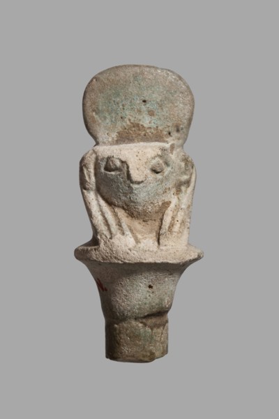 Amulet - falcon head on a column; papyrus capital of the column shows a falcon head in a striped