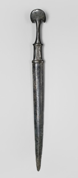 Dagger, unknown Luristan workshop. A fully cast dagger with a full hilt and a flared pommel. The