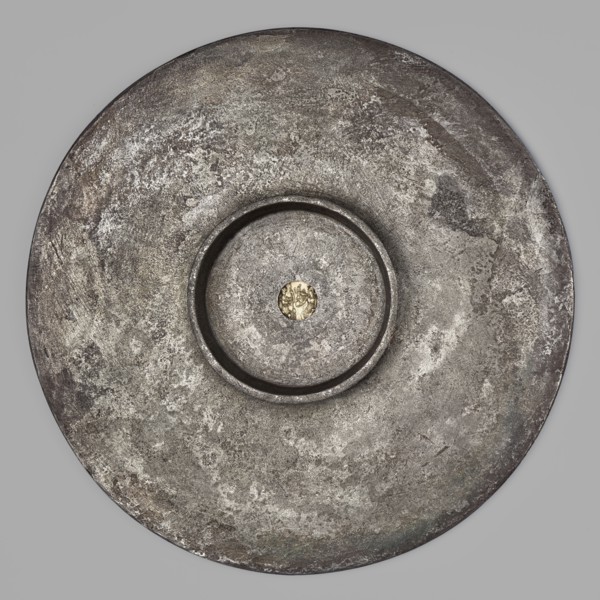 Platter with a gold medallion of Theodosius II. Flat silver platter on a ring-shaped foot with