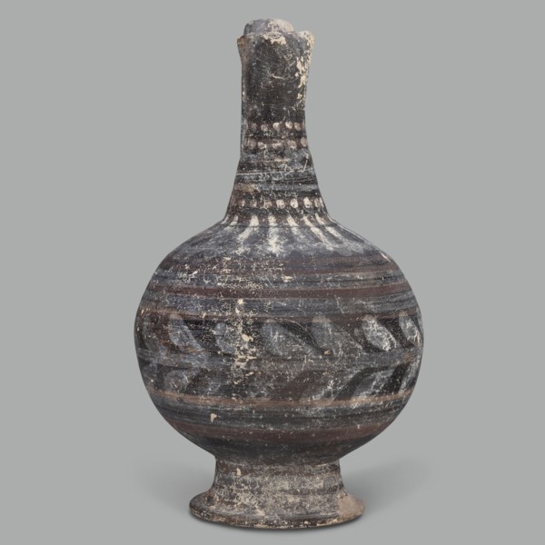 Oinochoe, unknown Cypriot workshop; Arsinoe Cyprus. Oinochoe on a cup-shaped foot with a spherical