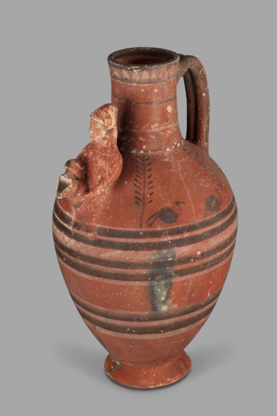 Jug with a figurine of a woman with a jug; Cypriot pottery, female appliqué figurine. Jug on a foot