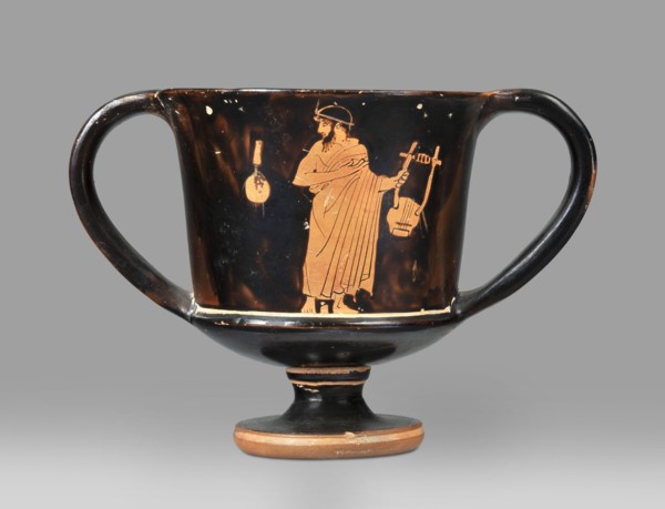 Red-figure kantharos with a depiction of an ephebe with an aryballos and a Greek inscription