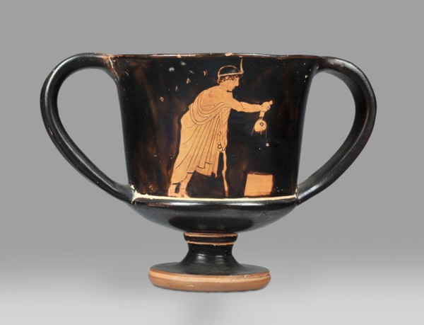 Red-figure kantharos with a depiction of an ephebe with an aryballos and a Greek inscription