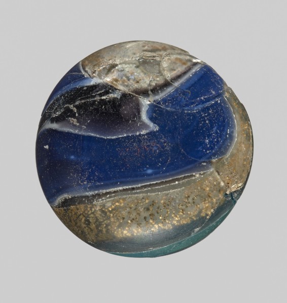 Unguentarium with carnation and a gold ribbon; bulging belly. Mosaic glass small bottle with