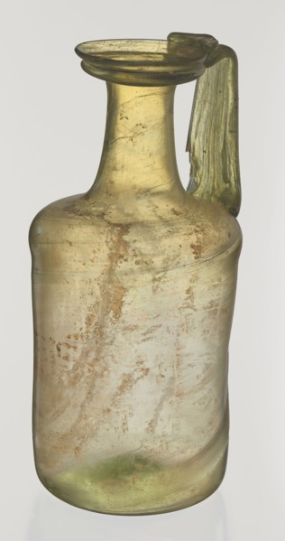 Jug. Cylindrical body, high neck with flared spout and vertical vice. 2nd–3rd century AD. Syria.