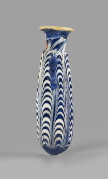 Alabastron, Egyptian workshop, 6th–5th century BC. Opaque dark blue glass alabastron decorated with