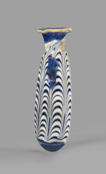 Alabastron, Egyptian workshop, 6th–5th century BC. Opaque dark blue glass decorated with
