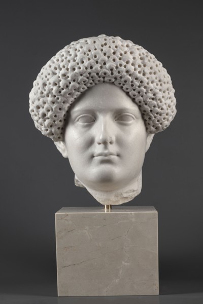 Portrait of a Roman woman, Head with a broad face and an elaborate hairstyle: hair twisted into