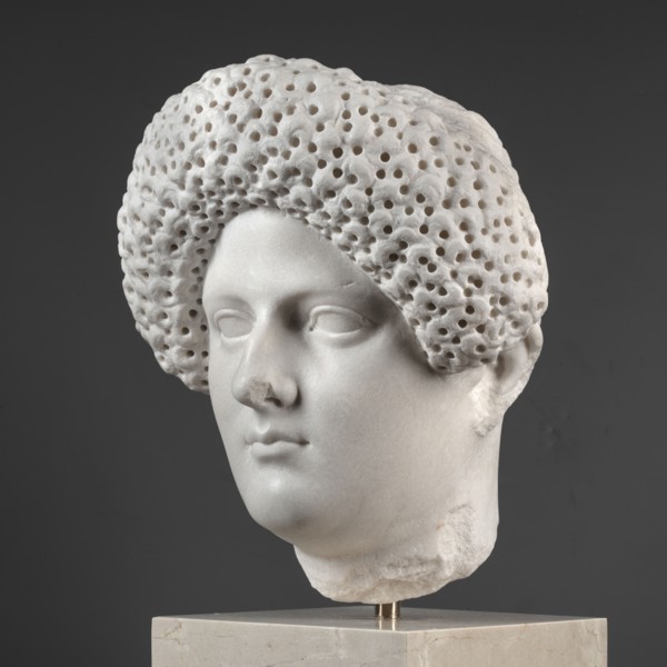 Portrait of a Roman woman, Head with a broad, round, full face and a triangular forehead; elaborate
