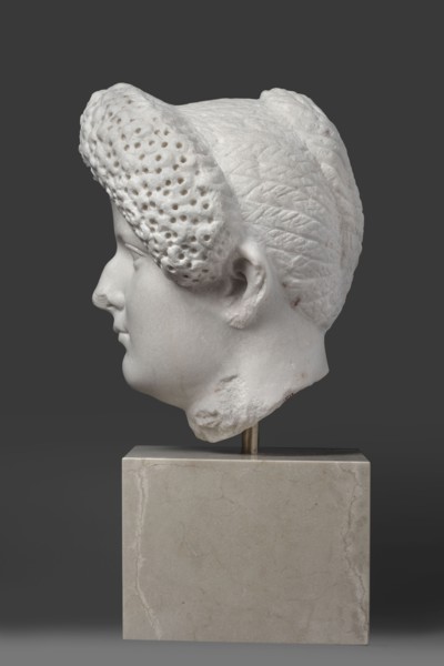 Portrait of a Roman woman, Head with a broad face and an elaborate hairstyle: hair twisted into