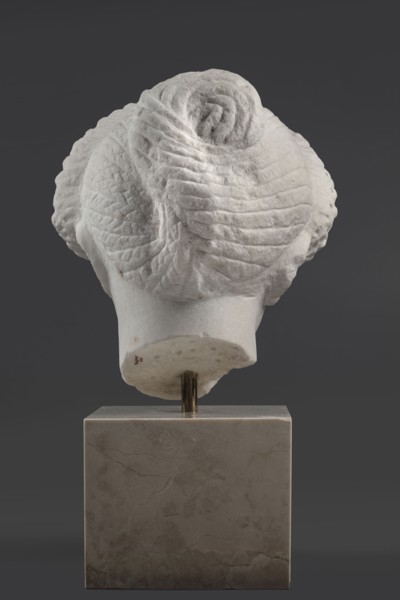 Portrait of a Roman woman, Head with a broad face and an elaborate hairstyle: hair twisted into